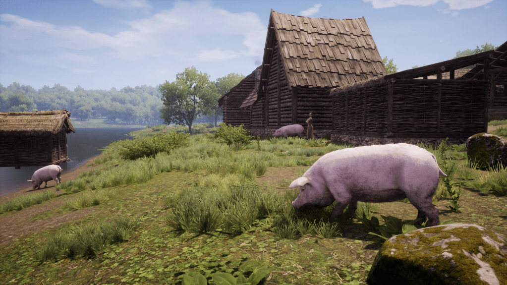 A collection of pigs grazing with a farmer keeping watch over them.