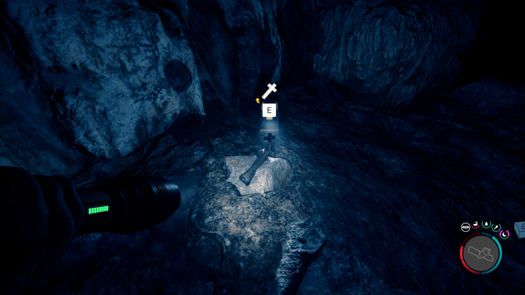 Arm holding a cross.